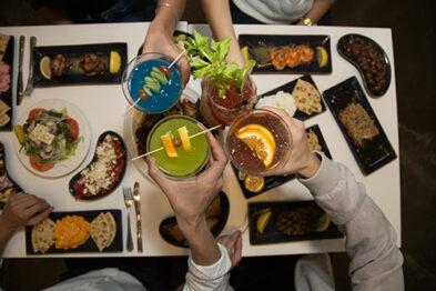 A chin with some colorful cocktails