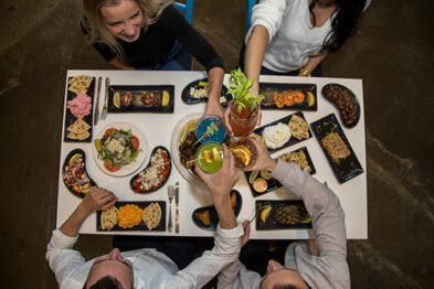 four clients happy to eat Souvlaki Bar