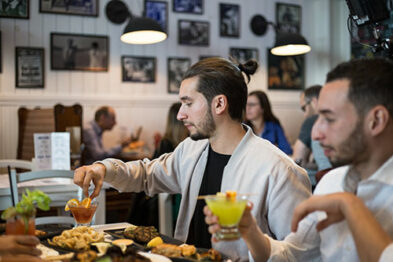 Two men about to taste their drink