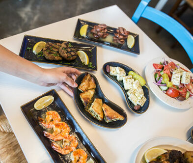Some Souvlaki Bar plates on a white table